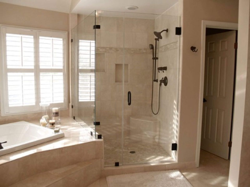 spacious shower with a frameless swing door